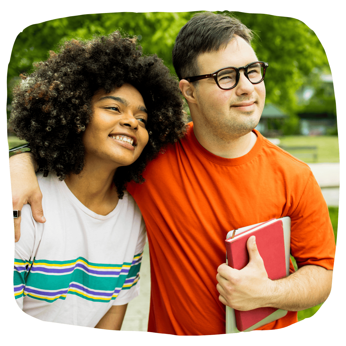 Man with arm around female friend