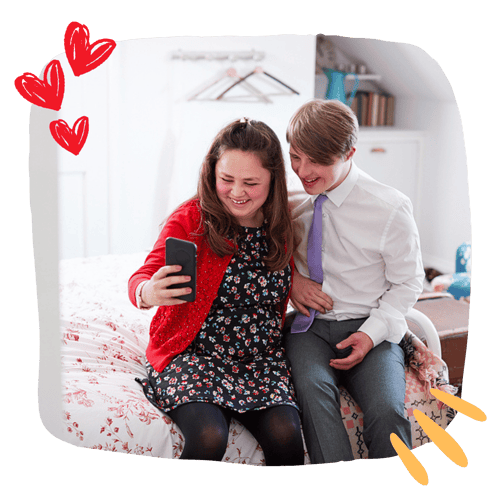 Young couple with down syndrome taking photos